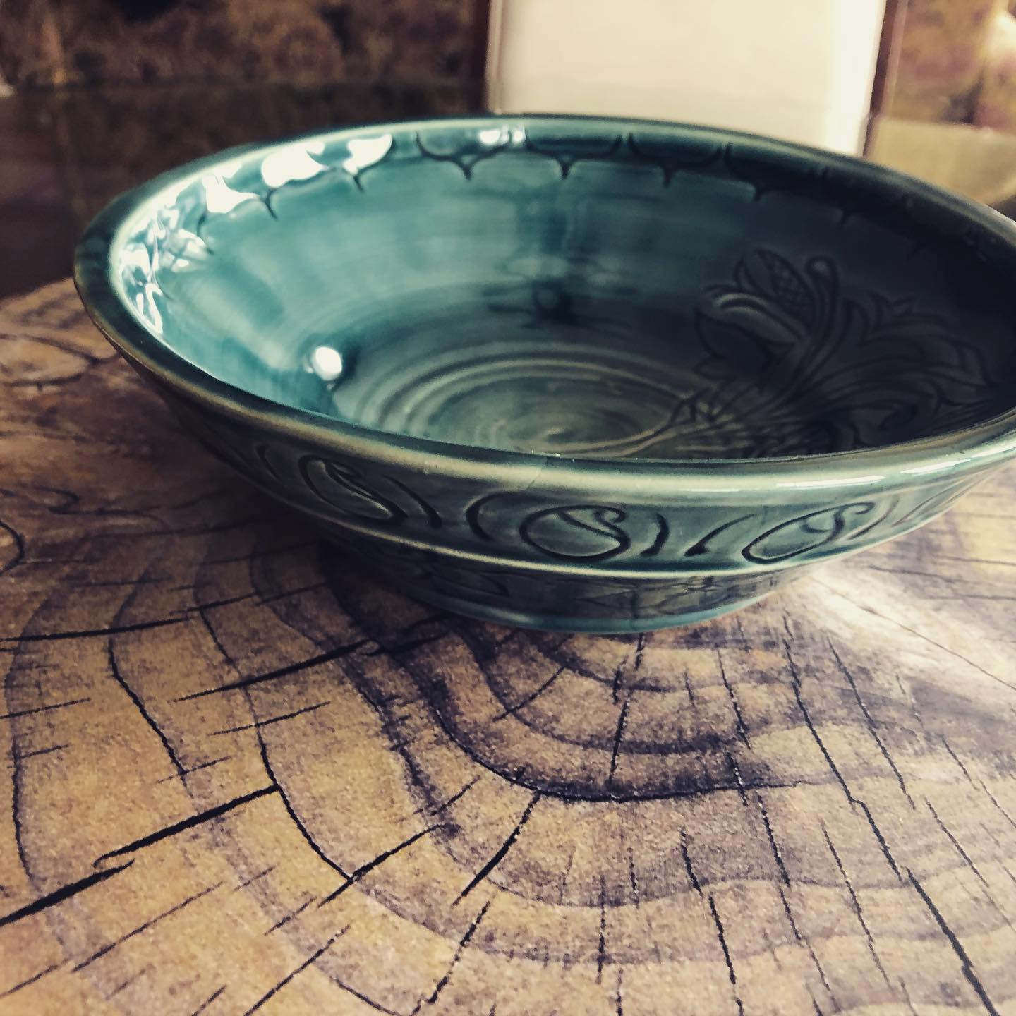 Unfired ceramic bowl on wheel