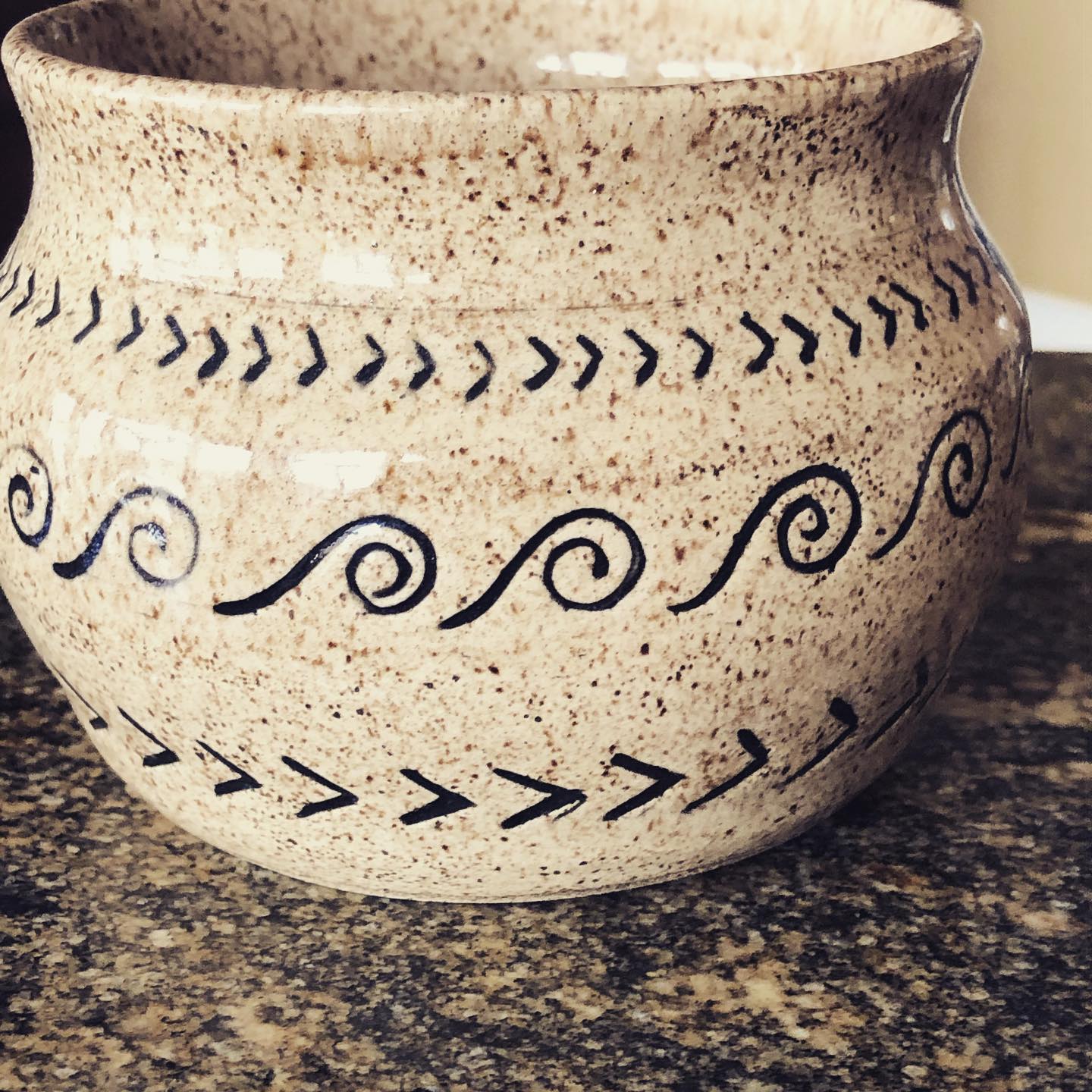 Speckled pottery with tribal patterns